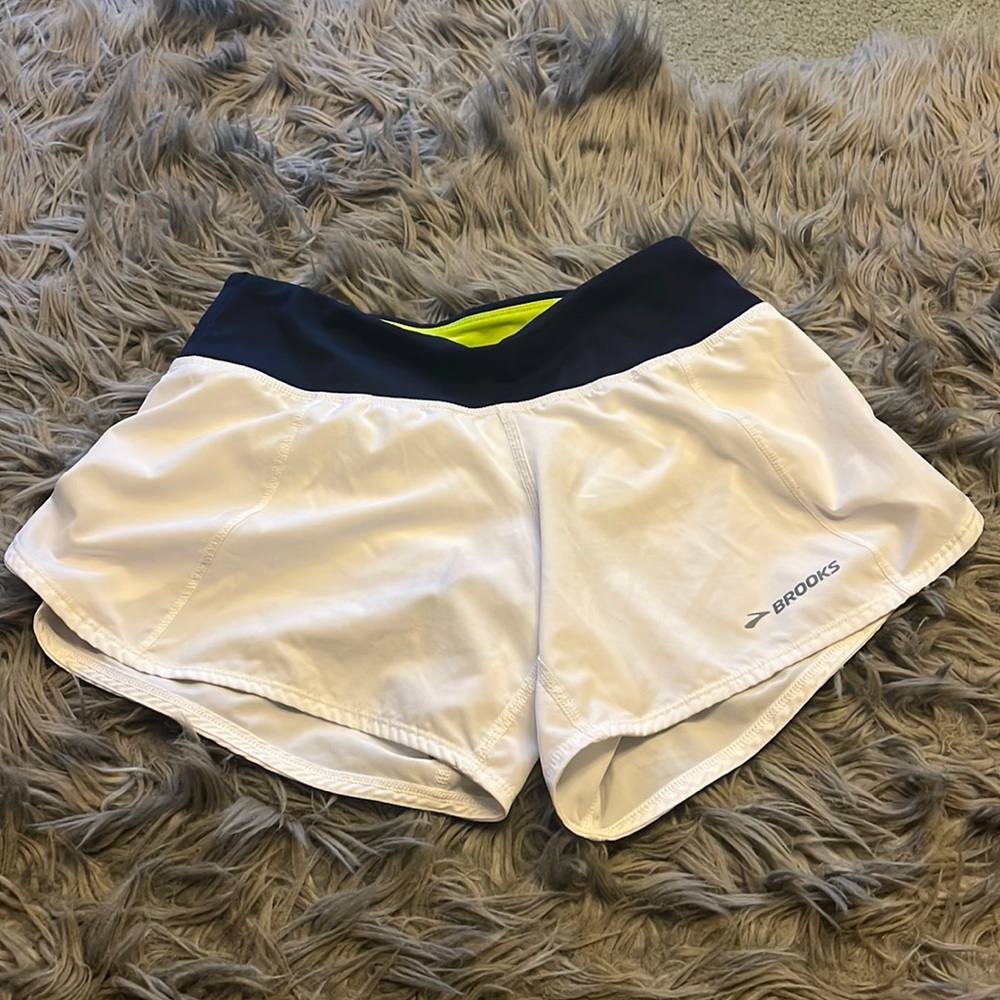 Brooks white running shorts.